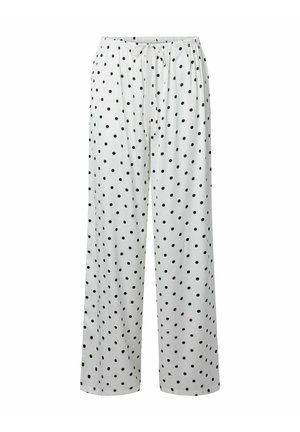 Pantalon blanc ample à pois noirs avec une taille élastique dotée d'un cordon ajustable.