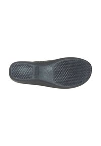 Suola di scarpa nera in gomma con superficie texturizzata e motivo a griglia. Bordo arrotondato e design piatto per supporto e comfort.