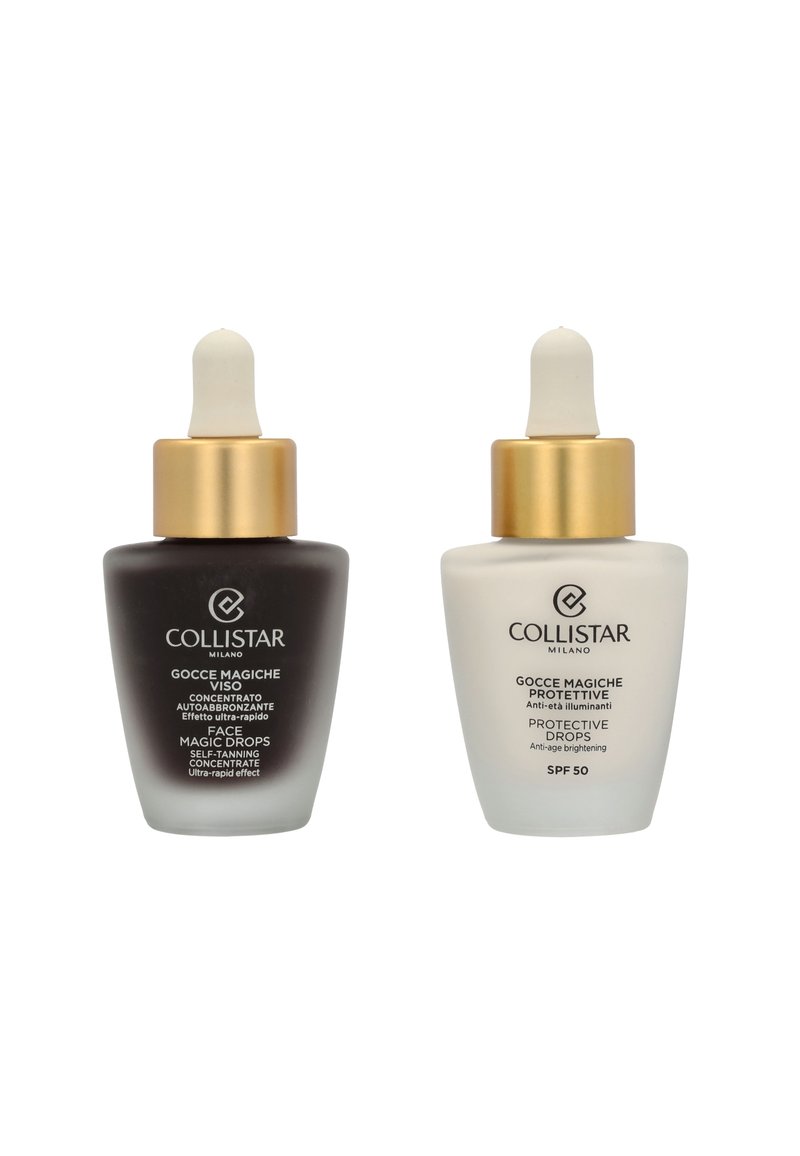 Two glass dropper bottles side by side. Left: dark brown with a gold cap, labeled "Face Magic Drops." Right: white with a gold cap, labeled "Protective Drops SPF 50."
