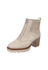Beige ankle boot with a smooth suede finish, front zipper, ribbed fabric accents, and a square heel featuring a textured wood-like design.