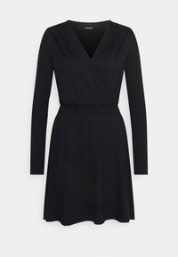 Robe noire à manches longues avec haut cache-cœur col en V et taille élastique, jupe évasée et ourlet à hauteur du genou.