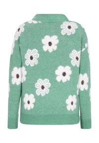 Grüner Pullover mit weißen Blumenmustern und braunen Zentren. Mit geripptem Kragen und Bündchen, aus weichem Strickmaterial gefertigt.