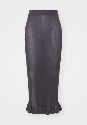 Fustă tip creion ribbată de culoare purpurie închisă, cu un talie ajustată și o margine volan la baza fustei. Fabricată dintr-un material tricotat texturat.