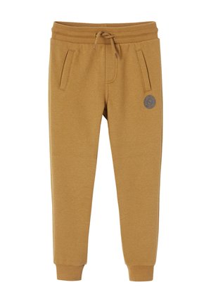 Light brown jogger pants with ribbed cuffs, drawstring waistband, two front pockets, and small round logo patch on left thigh.