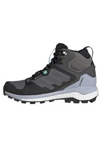 Scarpa da hiking a mezza altezza in nero e grigio, con tomaia in mesh testurizzato, suola in gomma con trazione e intersuola imbottita.