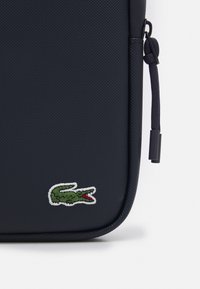 Lacoste FLAT CROSSOVER BAG UNISEX - Skulderveske - light adriatic blue