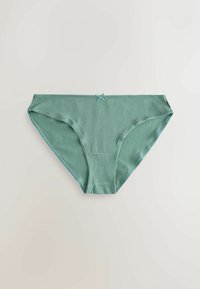 Culotte de bikini en coton vert pour femme avec un petit nœud sur la ceinture avant, posée à plat sur une surface claire.