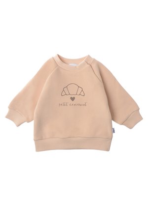 Beige sweatshirt with raglan sleeves, ribbed cuffs, and a rounded neckline. Features a croissant graphic and "petit croissant" text on the front.