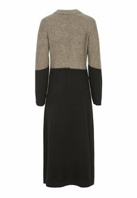 Stickad klänning med en färgblockdesign med en beige övre del och en svart nedre del; långa ärmar och rund halsringning.