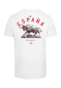 Baltas marškinėliai su bulių statula, viršuje raudona spalva užrašas "ESPAÑA" ir apačioje tekstas "¡A por ellos, oe!". Paprasta medžiaga ir standartinė forma.
