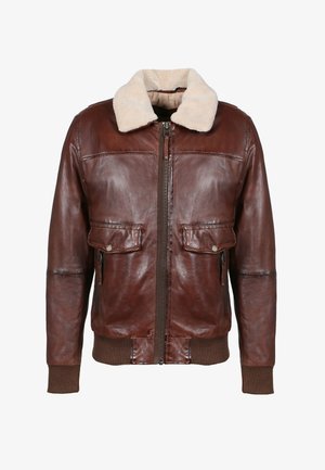 Braune Lederbomberjacke mit beigem Fellkragen, vorderem Reißverschluss, Klappentaschen sowie gerippten Bündchen und Saum.