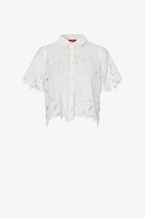 White short-sleeve button-up blouse with floral lace pattern and scalloped edges, featuring a small collar and red brand label inside.