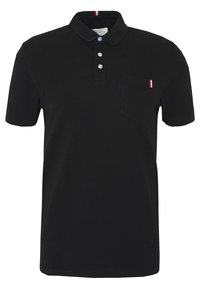 Polo-shirt noir en coton, avec une patte de boutonnage à trois boutons, des manches courtes et une poche sur la poitrine gauche avec un accent tricolore.