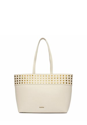 Bolso tote color crema con asas dobles, tachuelas circulares doradas cerca del borde superior y el logo "BADURA" centrado en la parte inferior.