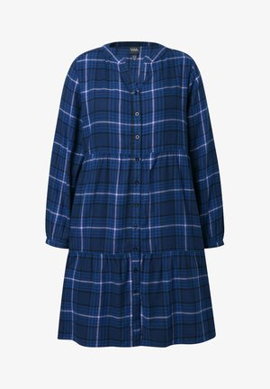 Vestido de cuadros en azul y negro de manga larga con frente abotonado y falda de volantes.