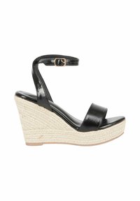 Sandali wedge in pelle nera con cinturino alla caviglia e due ampie fasce anteriori. La piattaforma è rivestita in juta per un effetto texture e contrasto.