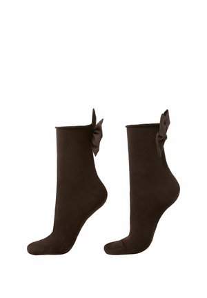 Calcetines tobilleros marrones con una textura suave y un detalle decorativo de lazo en el puño. La parte superior elástica garantiza un ajuste ceñido.