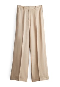 Pantalon large beige avec passants pour ceinture, poches latérales et fermeture à l'avant, présenté à plat sur un fond blanc.