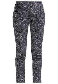 Pantalon slim noir et blanc à motifs avec taille élastique et poches latérales.
