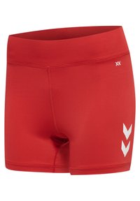 Red athletic shorts with wide waistband, flat seams, and two white chevron arrows on the right thigh.