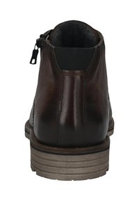 Braune Leder-Ankle-Boots mit glatter Oberfläche, elastischer Seitenpartie, Reißverschluss und einer geschichteten Gummisohle in Tan und Schwarz.