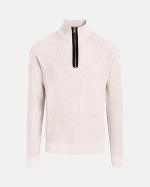 Világosbézs hosszú ujjú kötött pulóver fekete első cipzárral, amely a nyaktól a mellkas közepéig ér.