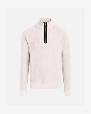 Svetlo bež pulover z dolgimi rokavi, s črnim zadrgo spredaj, ki sega od vratu do sredine prsnega koša.