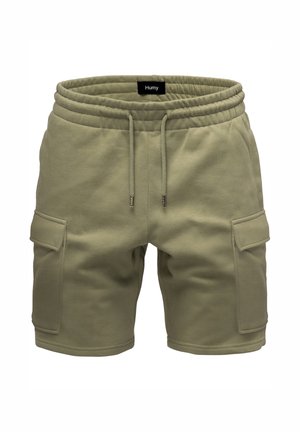 Khaki cargo shorts with elastic waistband, adjustable drawstring, side flap pockets, and a "Humy" label on the inside waistband.