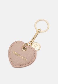 Heart-shaped keychain in soft pink leather; features embossed brand name "ANNA FIELD" in gold, attached to a gold chain and keyring.