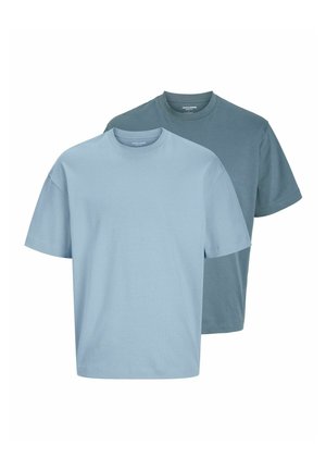Two crew-neck T-shirts made of cotton. One is light blue, the other in a darker blue shade. Both feature short sleeves and a relaxed fit.