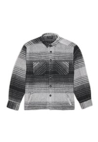 Camicia in flanella a quadri grigia e nera con maniche lunghe, due tasche frontali e chiusura a bottoni. Presenta motivi a contrasto e una finitura testurizzata.
