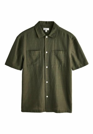Short-sleeve, olive-green shirt made of textured fabric, featuring two front pockets and white buttons along the placket.