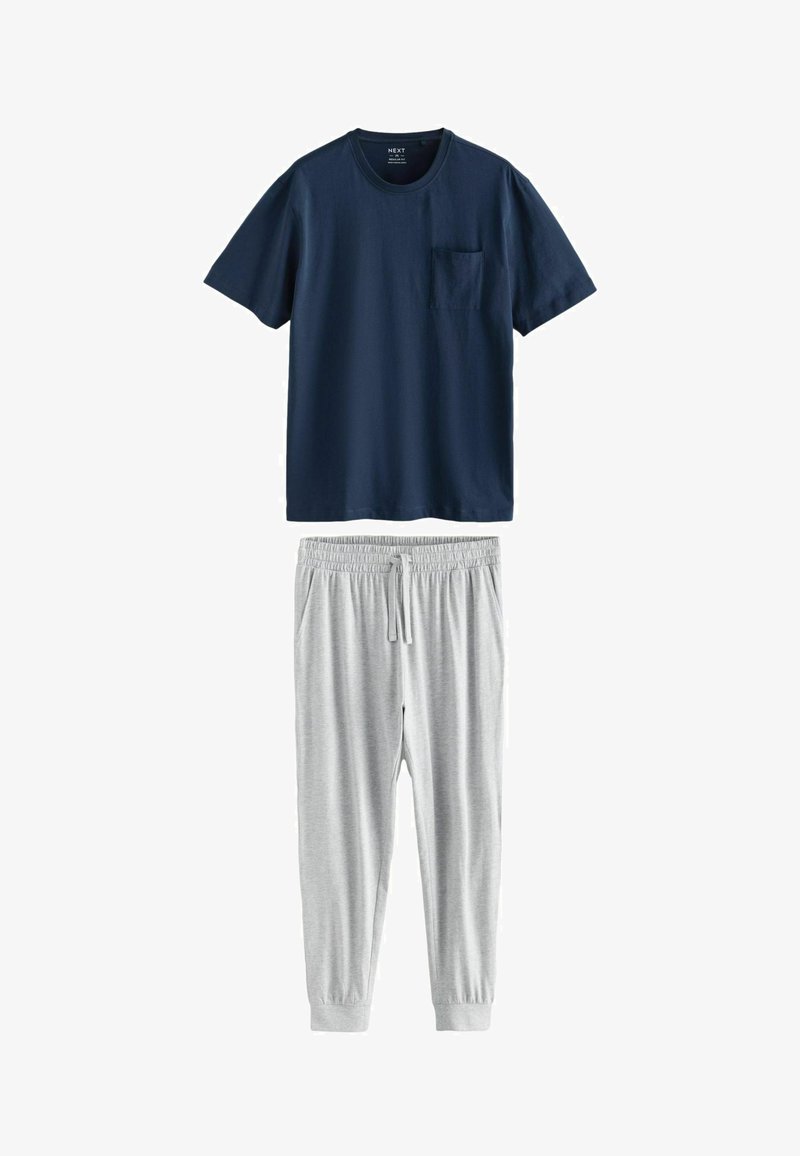 Dvojdielny set na voľný čas, ktorý obsahuje tmavomodré bavlnené tričko s vreckom a šedé tepláky s regulovateľnou šnúrkou a elastickými členkami.