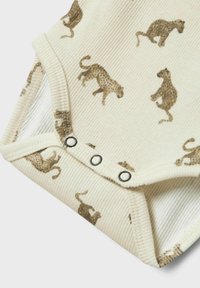 Krämfärgad ribbad bodysuit med ett leopardmönster i brunt. Tryckknappar i botten för enkel påklädning.