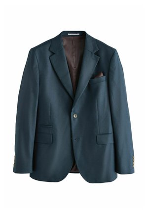 Man wearing blue pinstripe dress shirt, burgundy striped tie, and dark navy suit jacket against plain background.