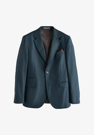 Man wearing blue pinstripe dress shirt, burgundy striped tie, and dark navy suit jacket against plain background.