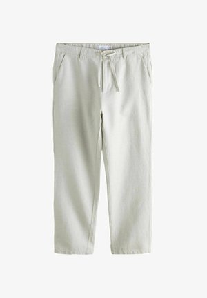 Jasnobeżowe, casualowe spodnie z elastycznym paskiem ściągającym, kieszeniami po bokach, szlufkami na pasek oraz prostymi nogawkami.