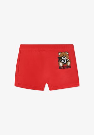 Bañador rojo hecho de una tela suave, con un diseño bordado de un oso de peluche y el texto "Toy Moschino" en el lado izquierdo.