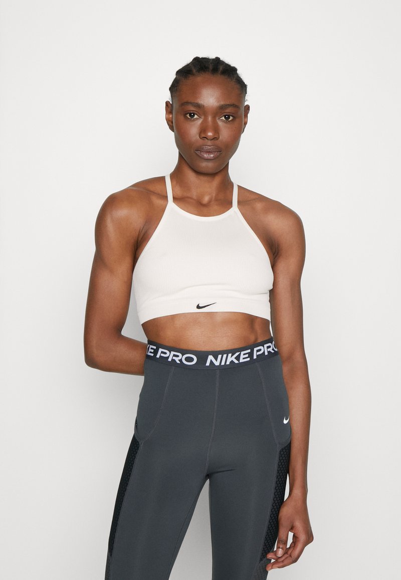 Nike Performance Light support sports bra sail/white/grey Zalando.ie