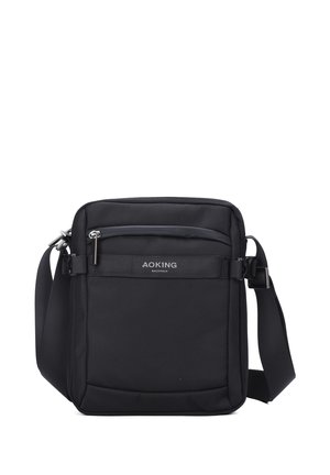 Borsa a tracolla nera realizzata in nylon resistente con una superficie testurizzata. Caratterizzata da una tasca frontale con zip e una tracolla regolabile.