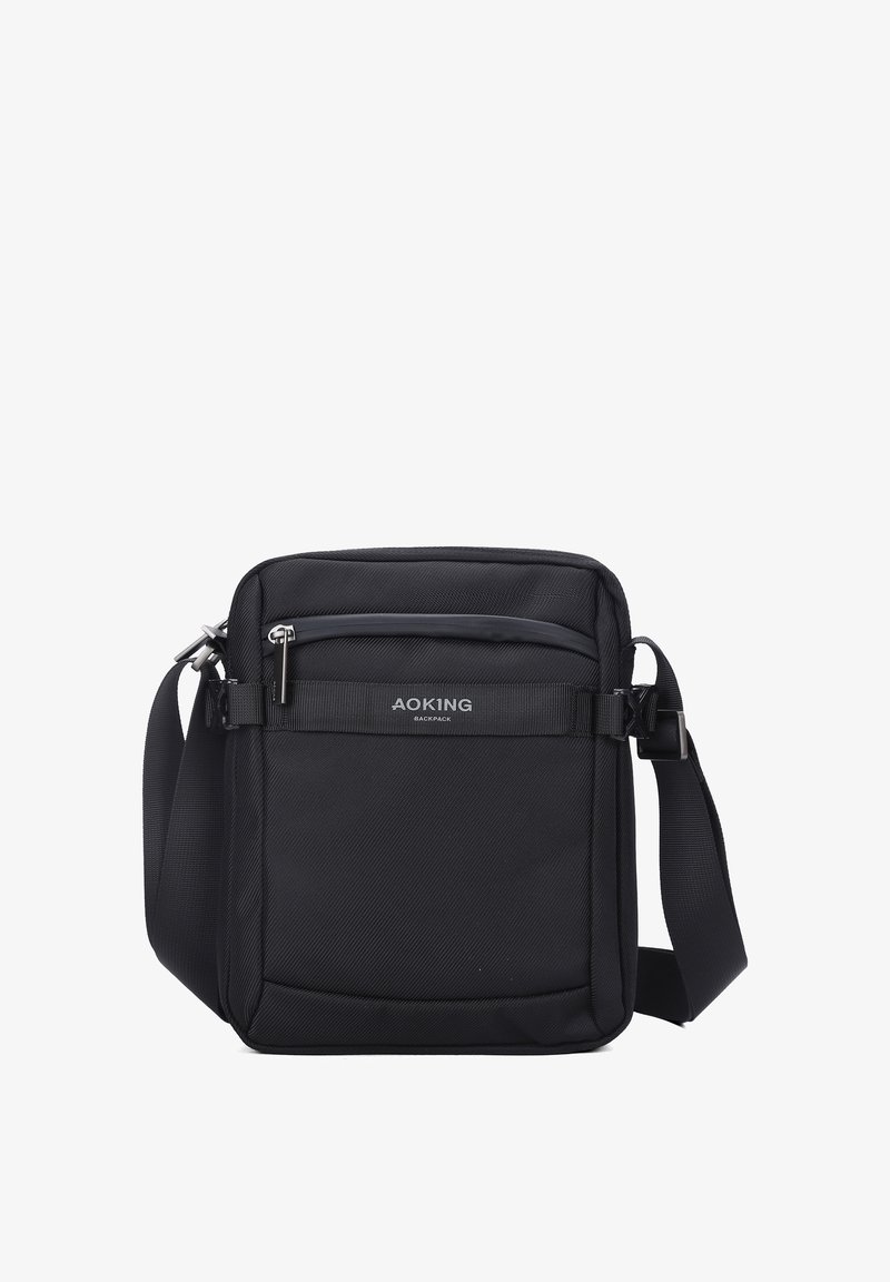 Borsa a tracolla nera realizzata in nylon resistente con una superficie testurizzata. Caratterizzata da una tasca frontale con zip e una tracolla regolabile.