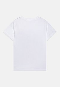 T-shirt en coton blanc à manches courtes, col rond et texture lisse. Le dos est uni, sans graphismes ni détails supplémentaires.