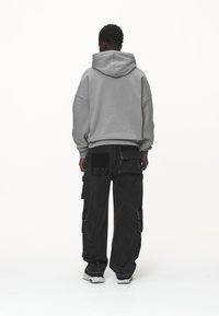Pegador Jersey con capucha - grey