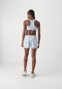 Nike Performance SWIFT SHORT - Sports shorts - light armory blue/silver