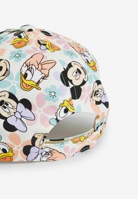 Cappello da baseball con stampe di personaggi dei cartoni animati su materiale in tela. Sfondo in pastello chiaro con motivi floreali e una cinturino regolabile sul retro.