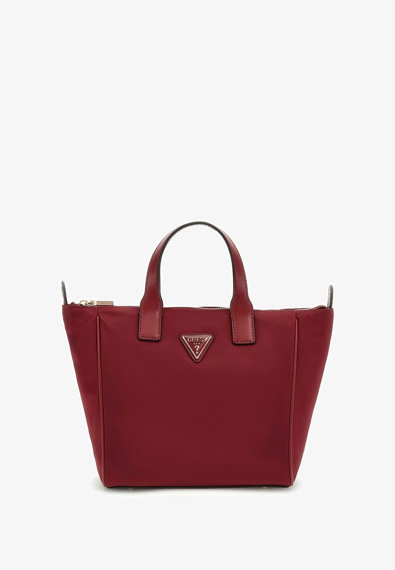 Bordeauxfarbene Tragetasche aus glattem Material, mit zwei oberen Griffen, einem Reißverschluss und einem Logo-Schild auf der Vorderseite.