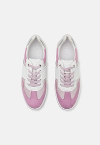 Pink and white sneakers featuring suede material, rounded toe, lace-up design, and textured accents along the sides and midsole.