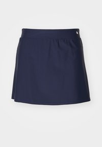 Temno modra kratka krilo z gladko teksturo, razširjenim dizajnom in elastičnim pasom. Ima majhen kovinski dodatek na pasu.