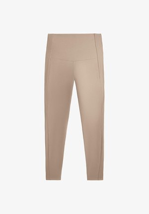 Beige Leggings aus elastischem Stoff mit hohem Bund und gerippten seitlichen Details. Enganliegende Form, glatte Textur, Knöchellänge.