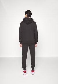 Puma BMW MMS - Pantaloni sportivi - black